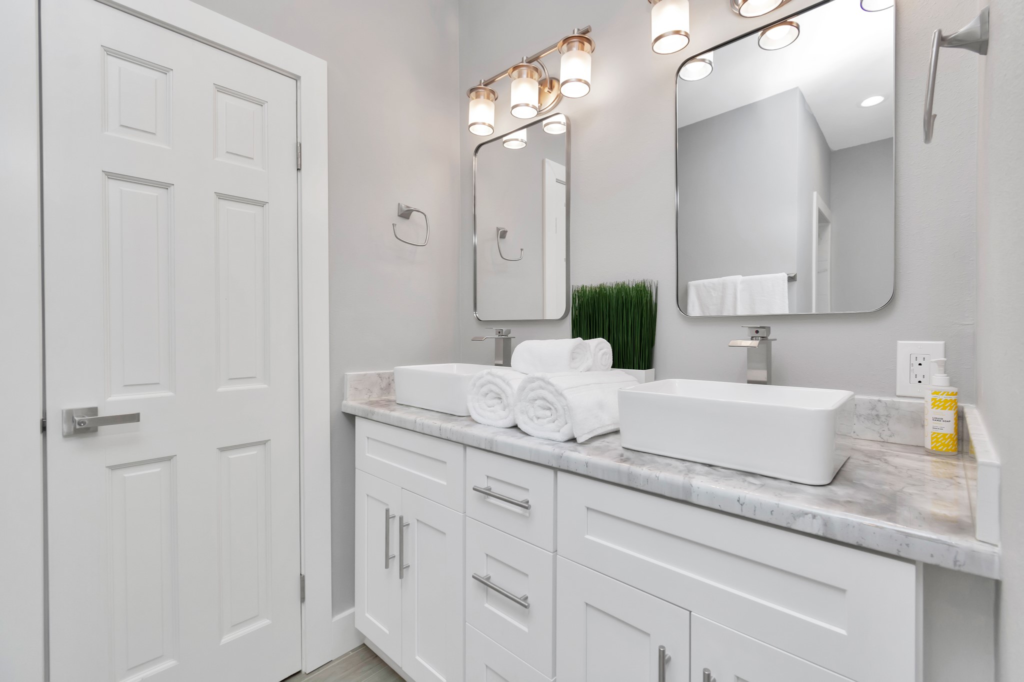 3315 Rosedale Street Houston, TX 77004 - Photo 17 of 32 a bathroom with a granite countertop sink a mirror and shower