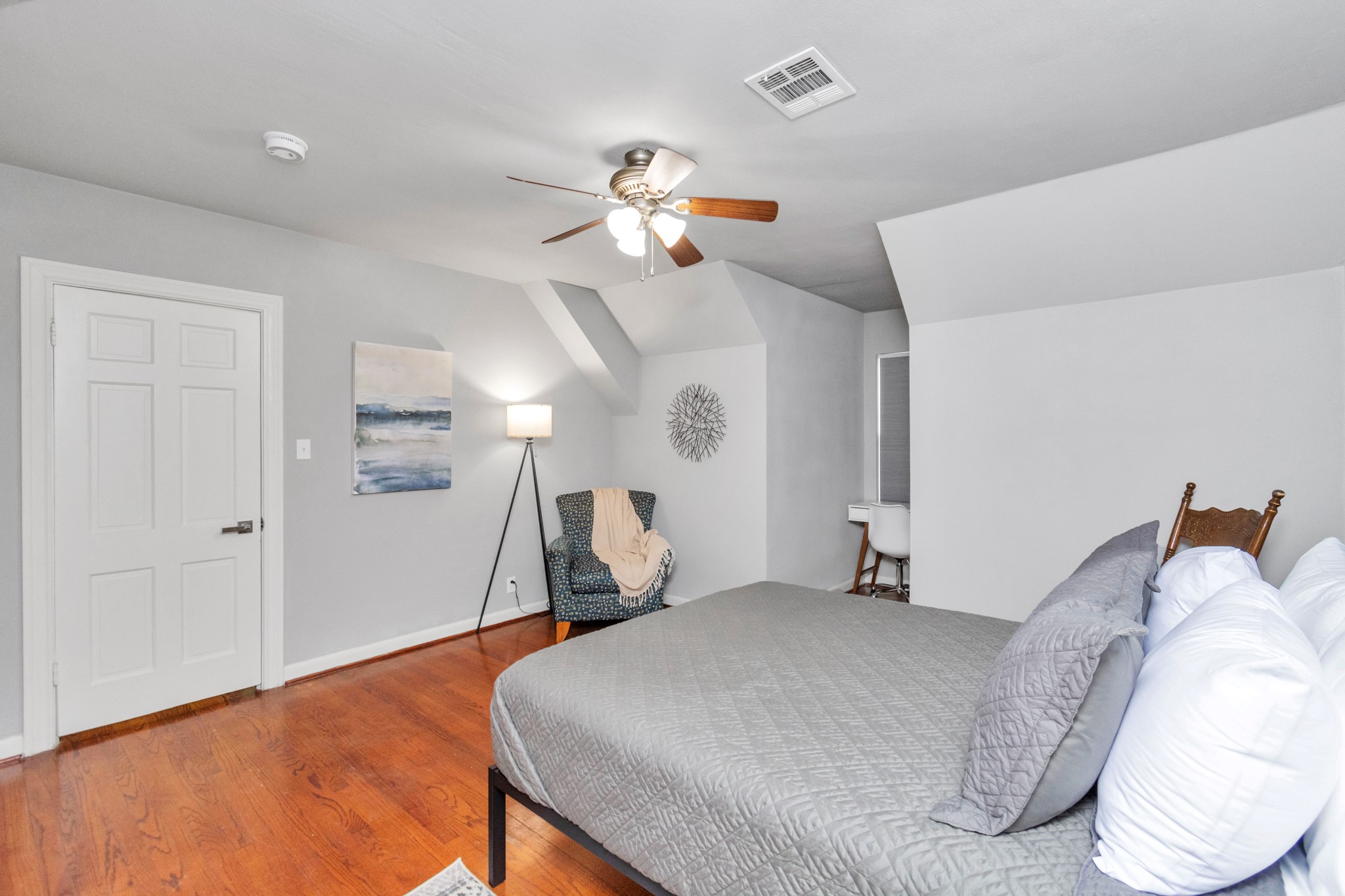 3315 Rosedale Street Houston, TX 77004 - Photo 23 of 32 a bedroom with a bed and a chandelier