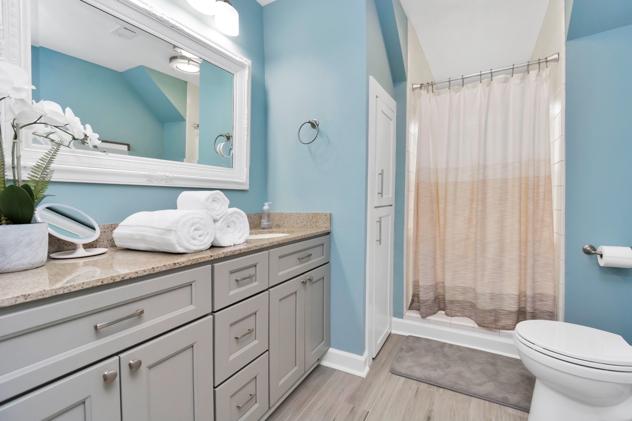 3315 Rosedale Street Houston, TX 77004 - Photo 25 of 32 a spacious bathroom with a granite countertop sink toilet and shower