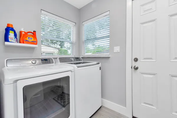 a utility room with dryer and washer