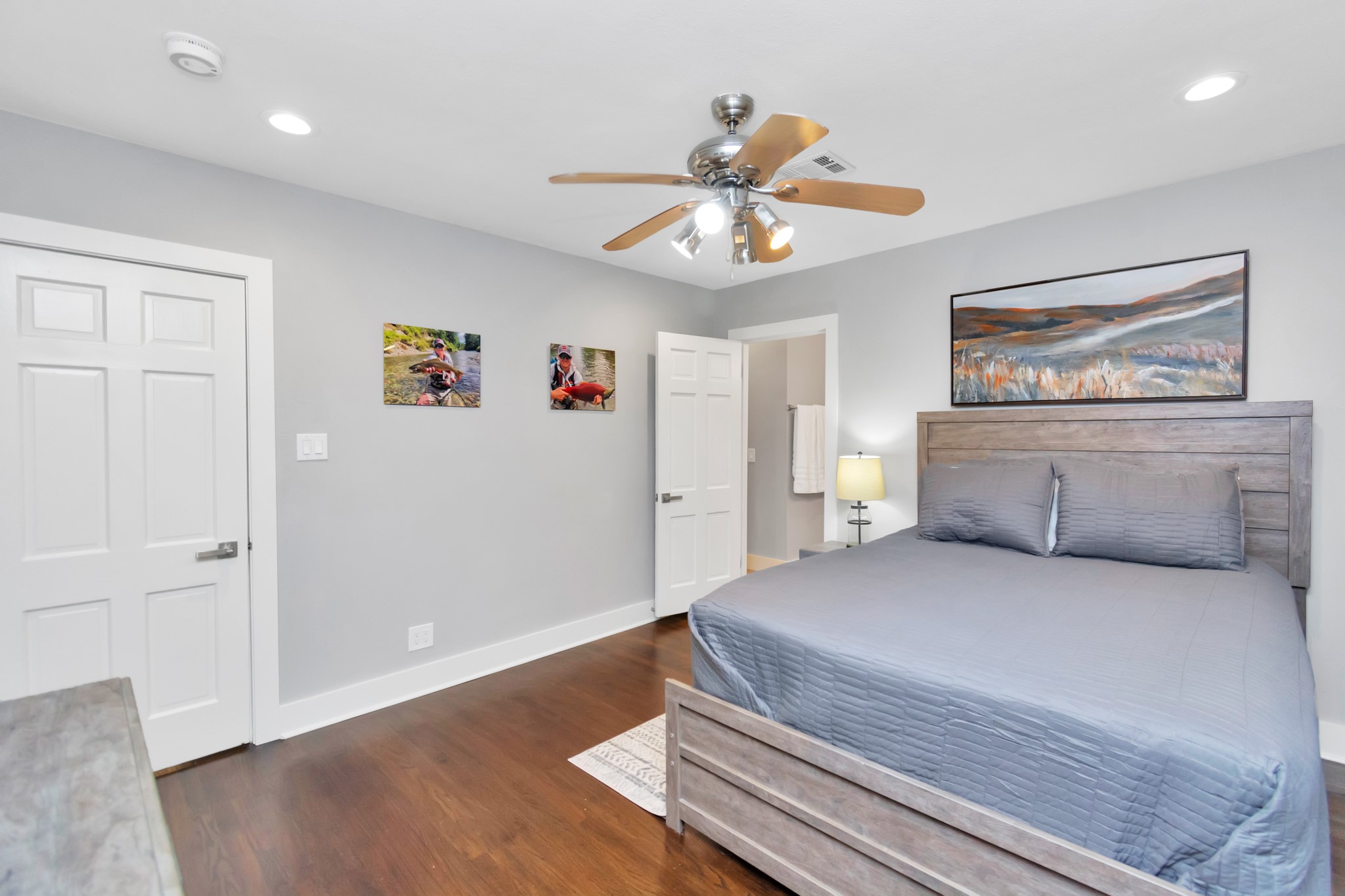 3315 Rosedale Street Houston, TX 77004 - Photo 5 of 32 a bedroom with a bed and a chandelier