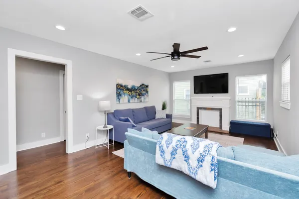a living room with furniture and a fireplace