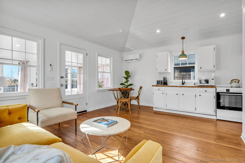 69 Waterside Lane, Unit 3 Clinton, CT 06413 - Photo 13 of 18 a living room with furniture and wooden floor