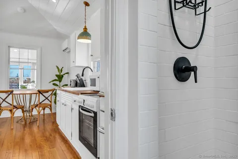 a bathroom with a sink a mirror and a shower