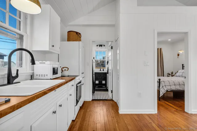 a kitchen with sink and cabinets