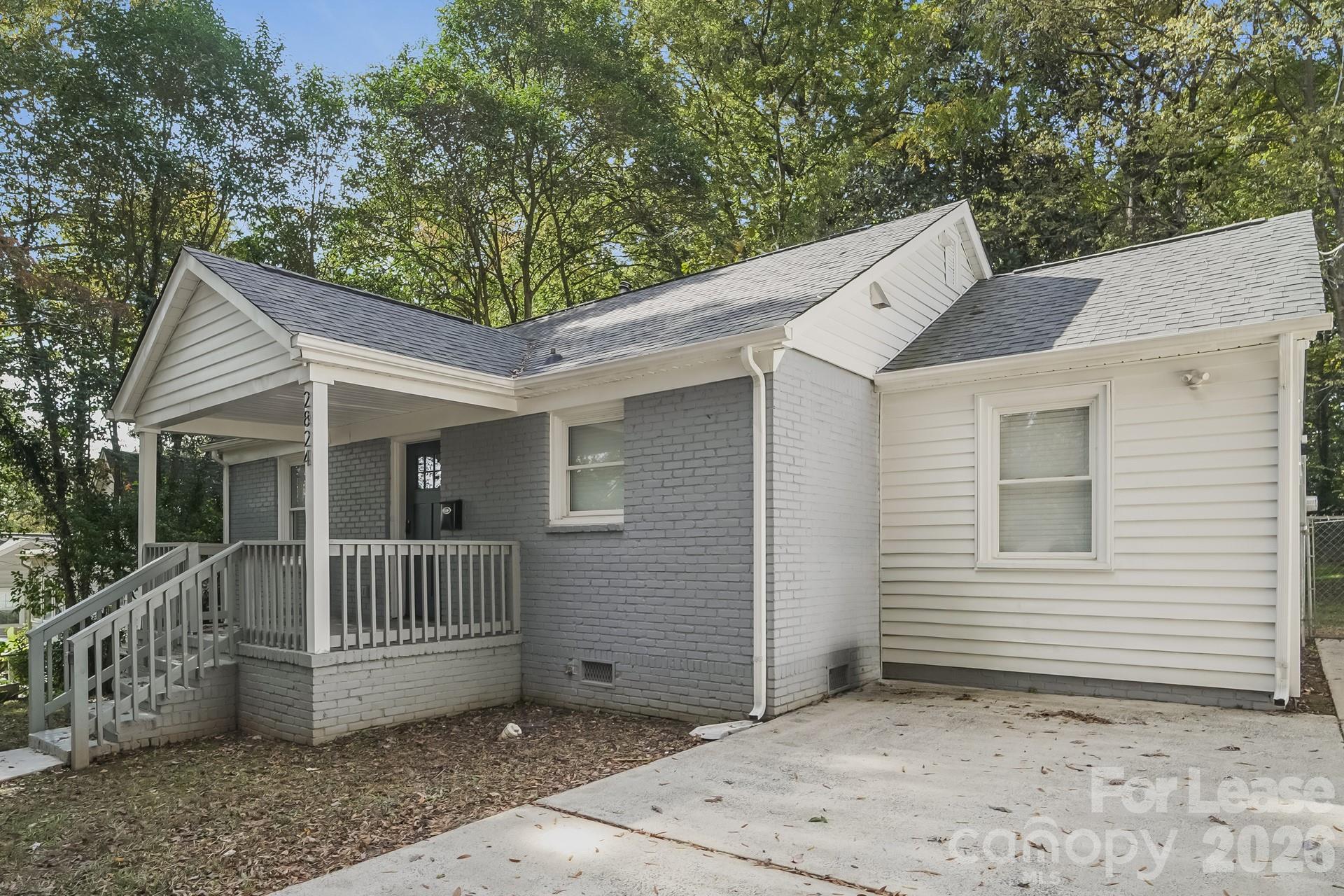 2824 Beech Nut Road Charlotte, NC 28208 - Photo 2 of 16 a view of a house with a yard