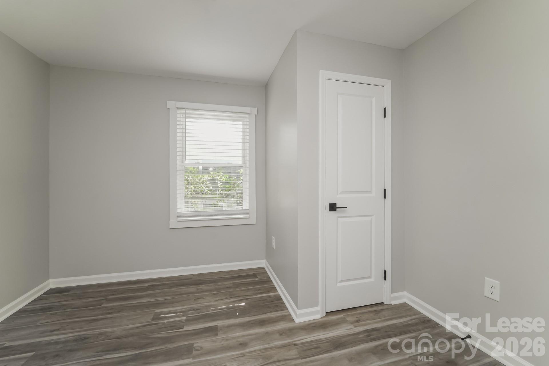 2824 Beech Nut Road Charlotte, NC 28208 - Photo 10 of 16 a view of a room with wooden floor and window
