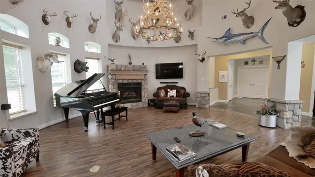 a living room with furniture a flat screen tv and a dresser