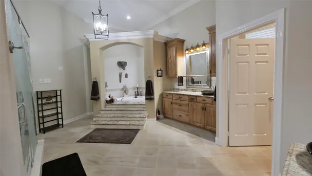 a bathroom with a double vanity sink a mirror a vanity and a shower