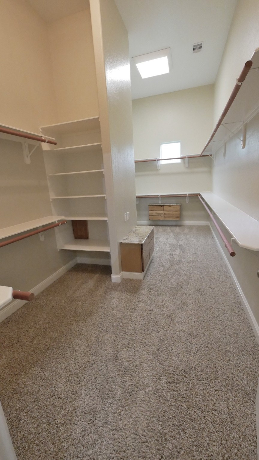 23478 Bays Chapel Road Richards, TX 77873 - Photo 27 of 49 a view of walk in closet with empty racks