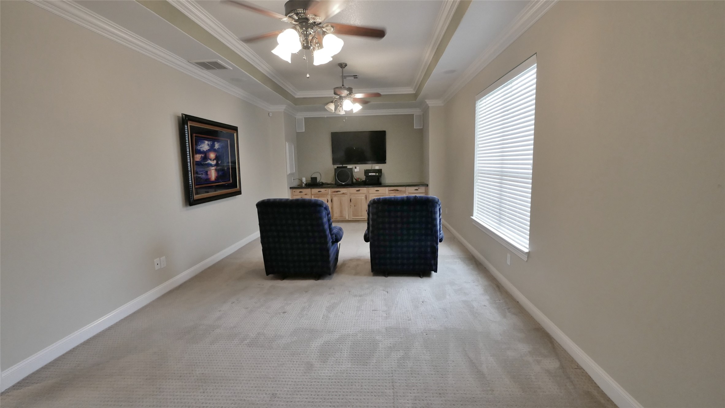 23478 Bays Chapel Road Richards, TX 77873 - Photo 29 of 49 a large room with windows and a ceiling fan