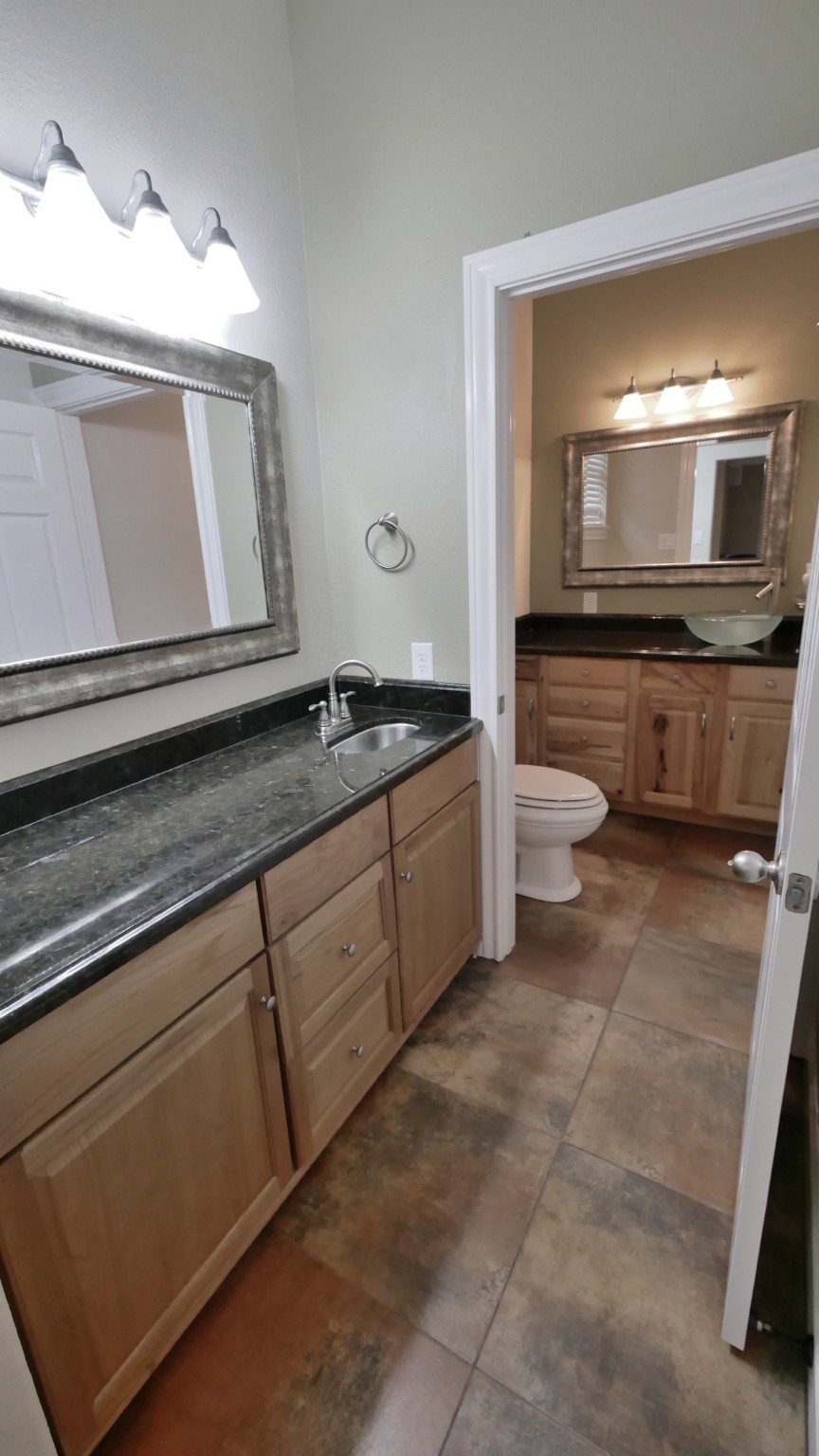 23478 Bays Chapel Road Richards, TX 77873 - Photo 33 of 49 a bathroom with a sink a toilet and mirror