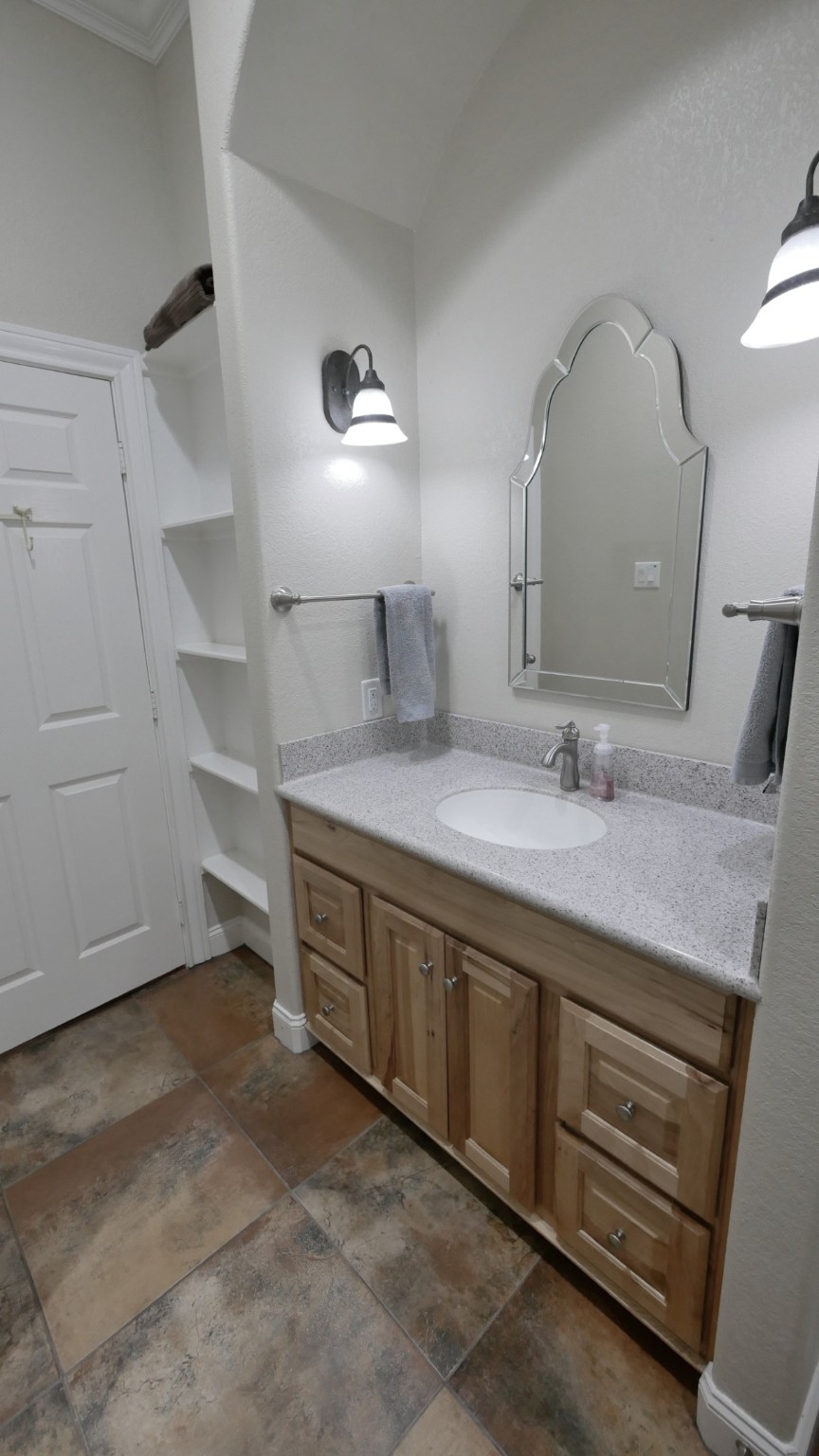 23478 Bays Chapel Road Richards, TX 77873 - Photo 35 of 49 a spacious bathroom with a double vanity sink and a mirror