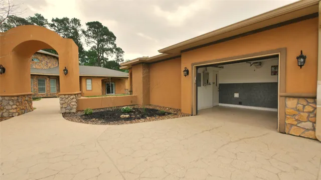 a view of a house with a snow in the yard