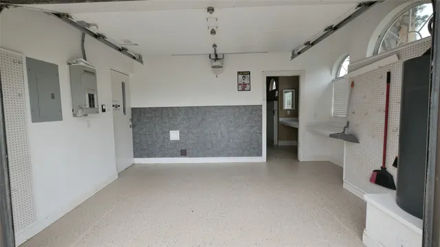 a view of a kitchen with a refrigerator and a sink