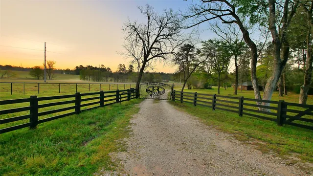a view of park with wooden fence