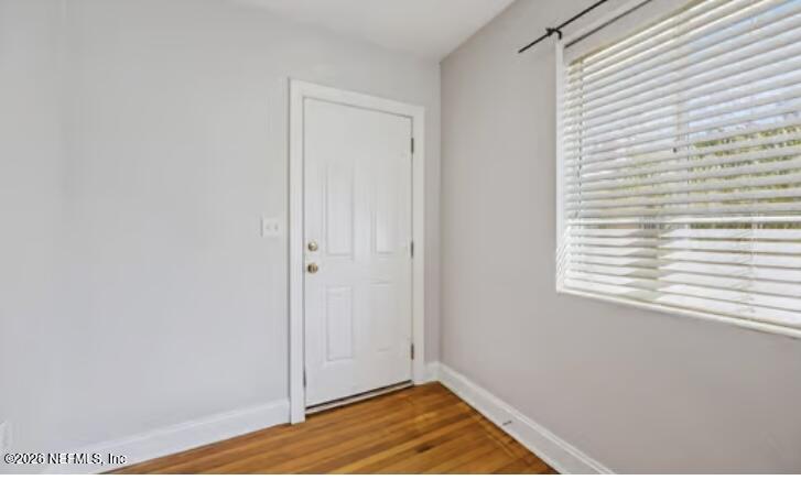 2159 Riverside Avenue, Unit 7 Jacksonville, FL 32204 - Photo 6 of 29 a view of a room with wooden floor and a window
