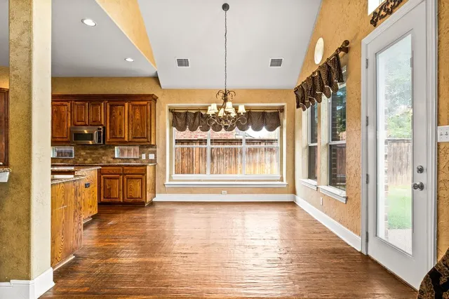 a view of a livingroom with a ceiling fan and window
