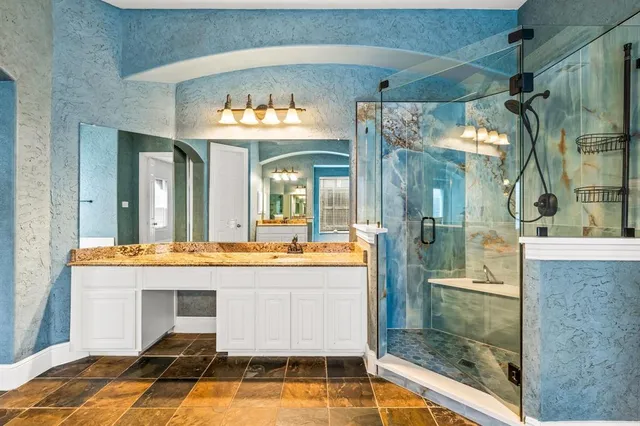 a dining room with furniture a chandelier and a rug