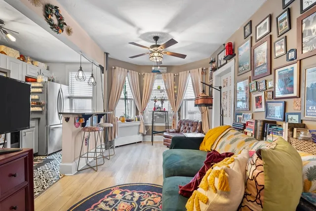 a living room with furniture fireplace and a flat screen tv