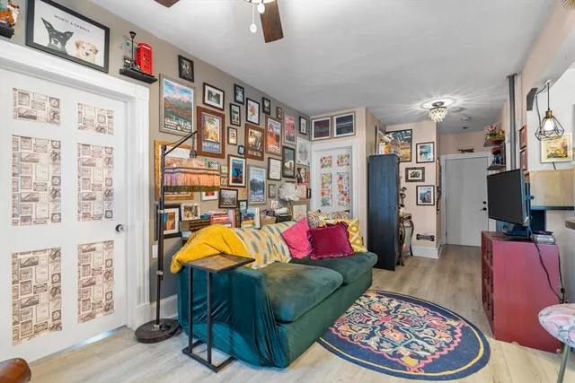 a living room with furniture and a rug