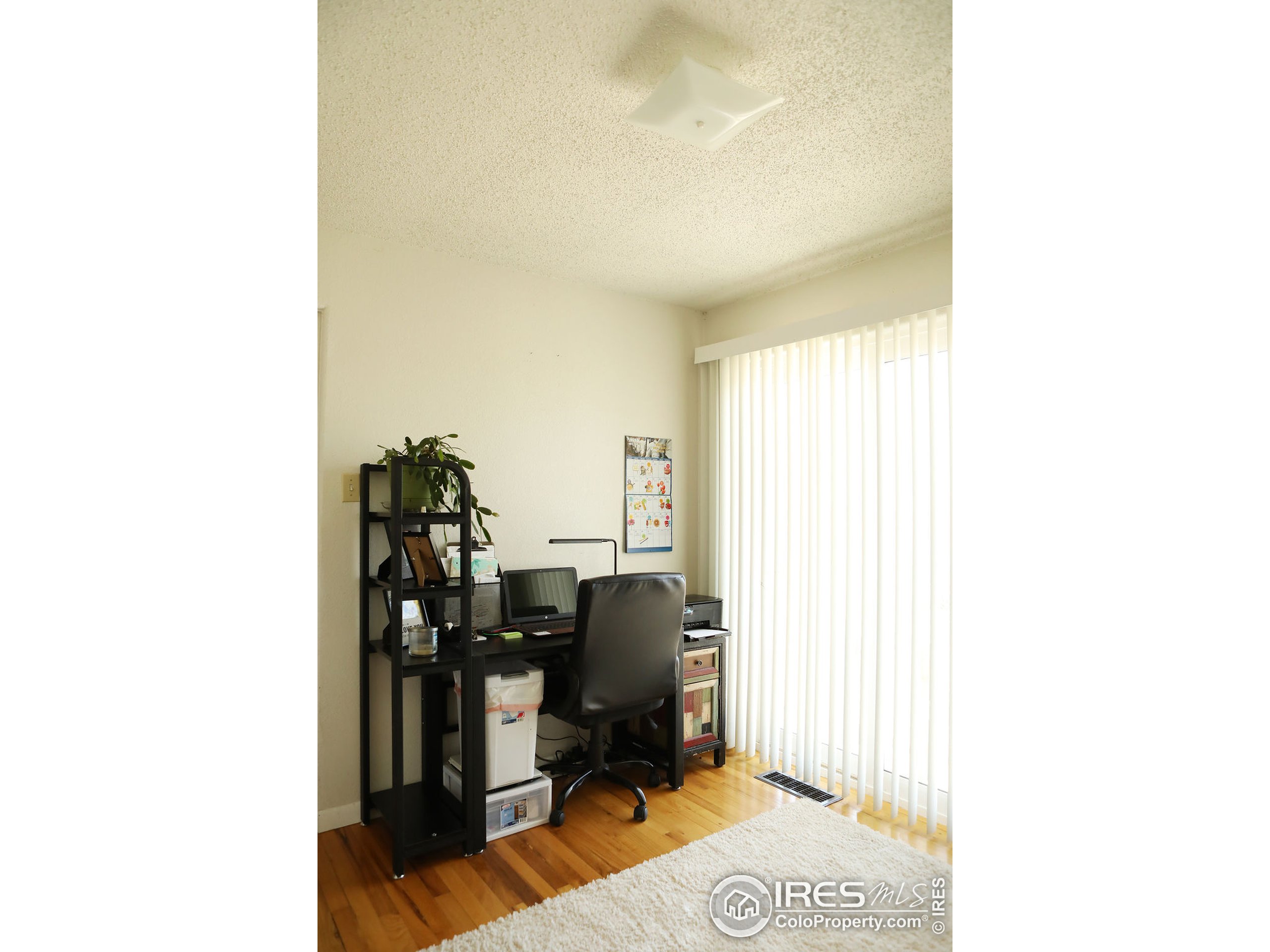 1150 County Rd M 5/10 Wiggins, CO 80654 - Photo 12 of 31 a view of a workspace with furniture and a window