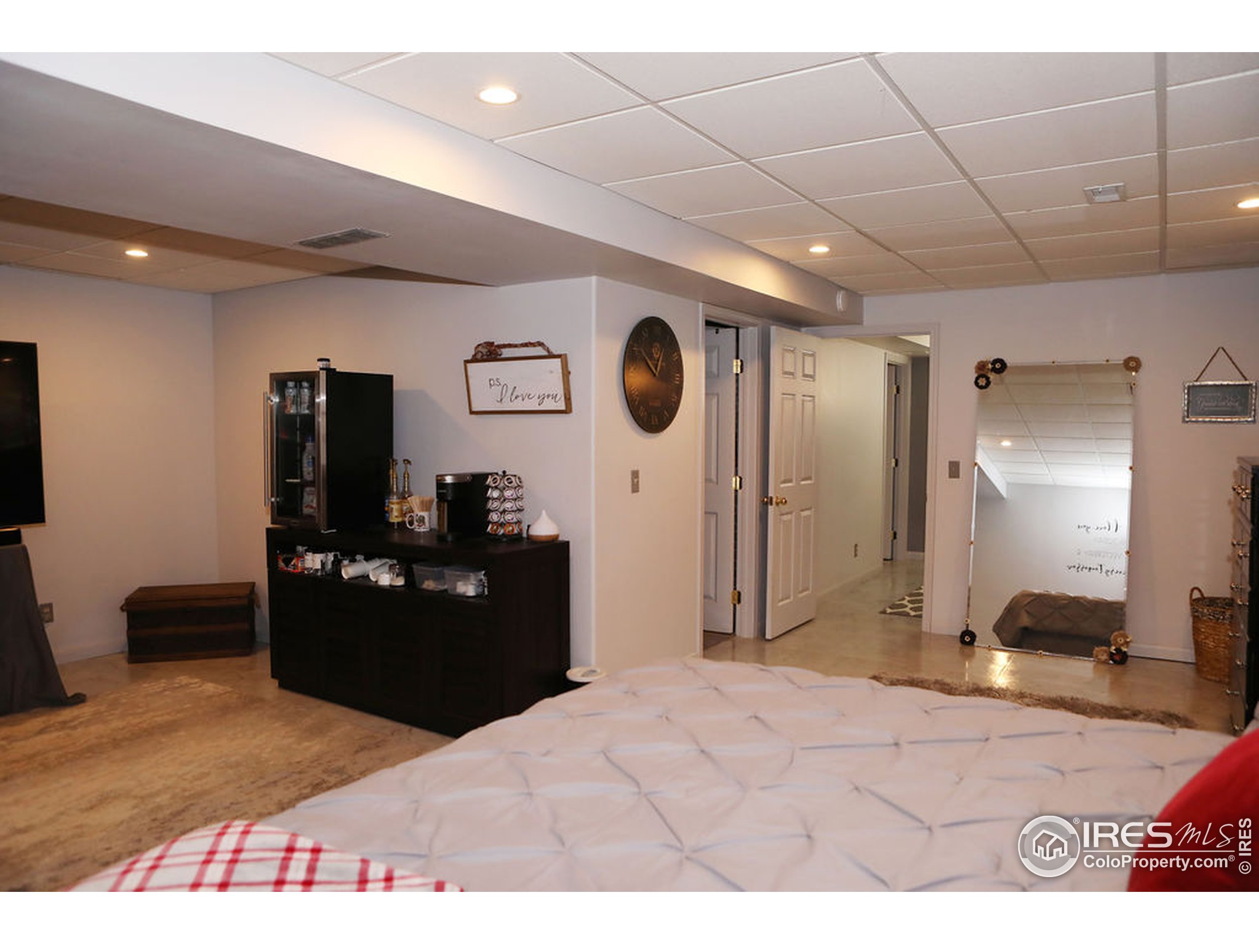 1150 County Rd M 5/10 Wiggins, CO 80654 - Photo 14 of 31 a view of a livingroom with kitchen and furniture