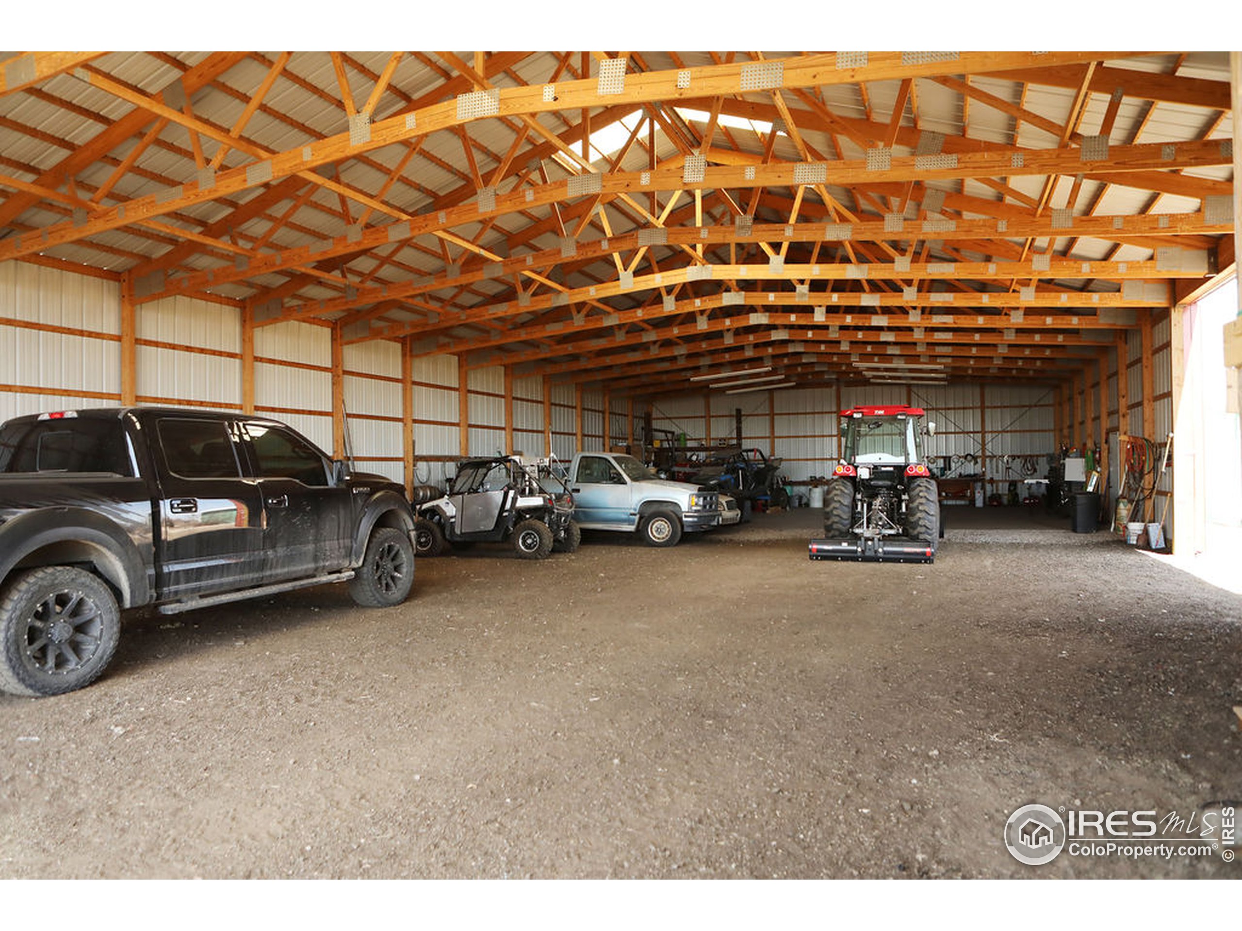 1150 County Rd M 5/10 Wiggins, CO 80654 - Photo 22 of 31 a view of a cars parking space
