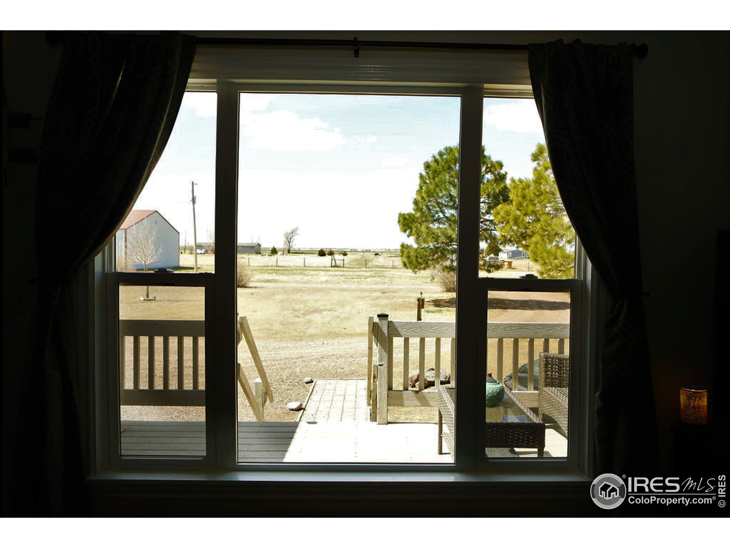 1150 County Rd M 5/10 Wiggins, CO 80654 - Photo 5 of 31 a view of an outdoor view from a window