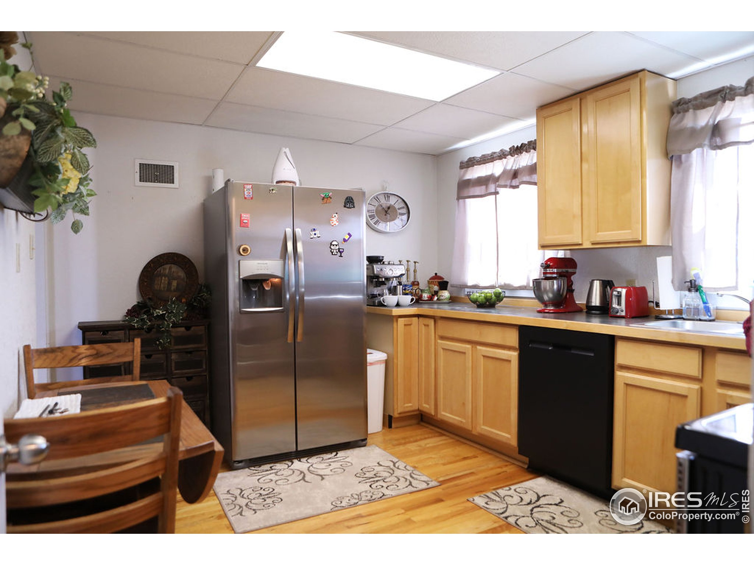 1150 County Rd M 5/10 Wiggins, CO 80654 - Photo 7 of 31 a kitchen with granite countertop a refrigerator and a stove