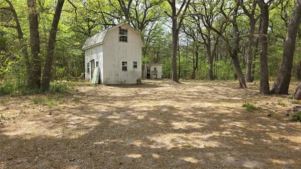 a house with trees in front of it