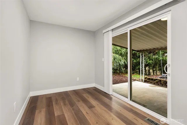 a view of wooden floor with a window