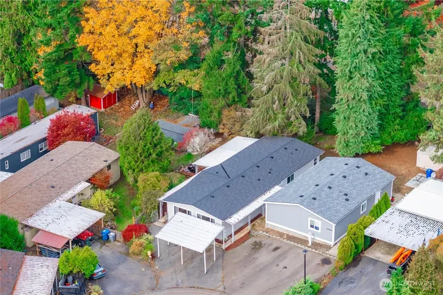 an aerial view of a house with a yard