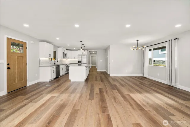 a view of kitchen with wooden floor