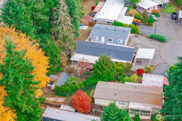 an aerial view of a house with a yard
