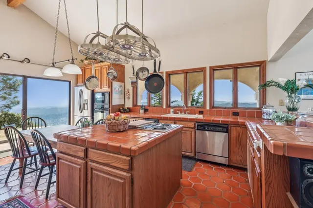 a kitchen with a sink and a stove