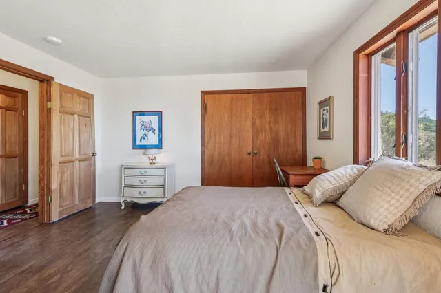 a bedroom with a bed and a dresser