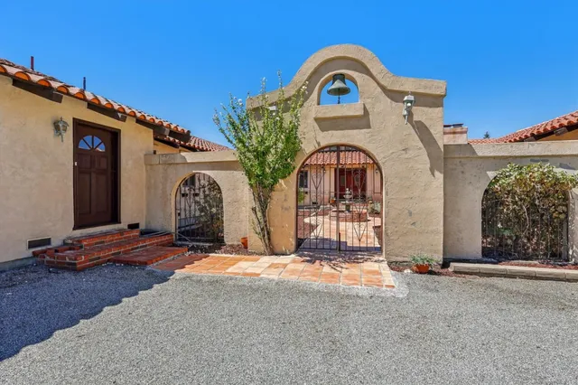 a view of a house with large windows