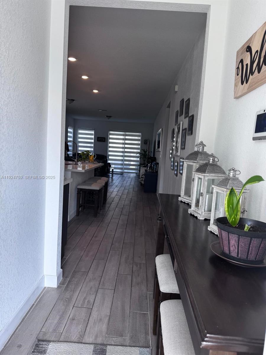 13201 Southwest 269th Terrace Homestead, FL 33032 - Photo 12 of 33 a living room with furniture and a wooden floor