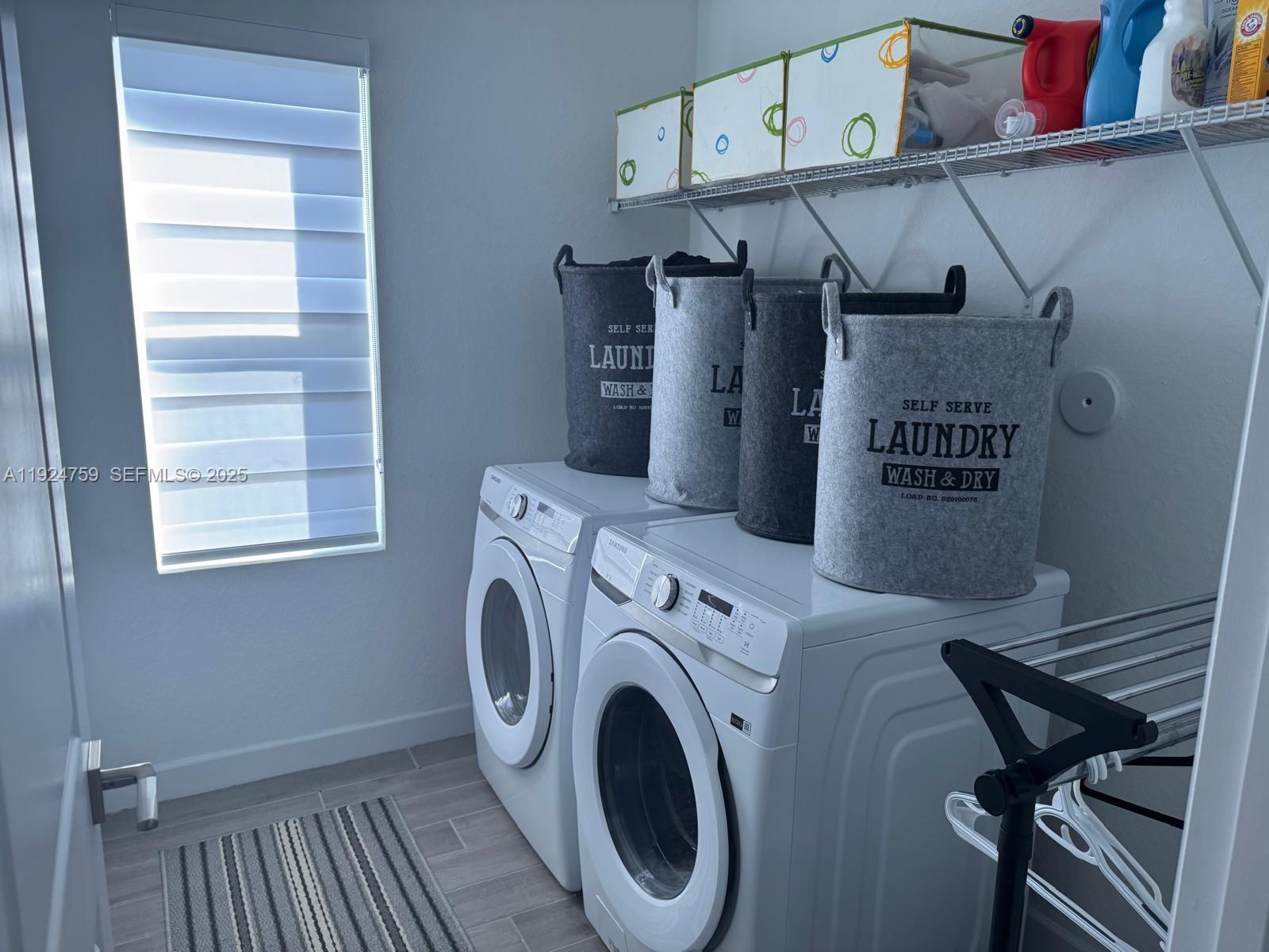 13201 Southwest 269th Terrace Homestead, FL 33032 - Photo 16 of 33 a view of storage and utility room with washer and dryer