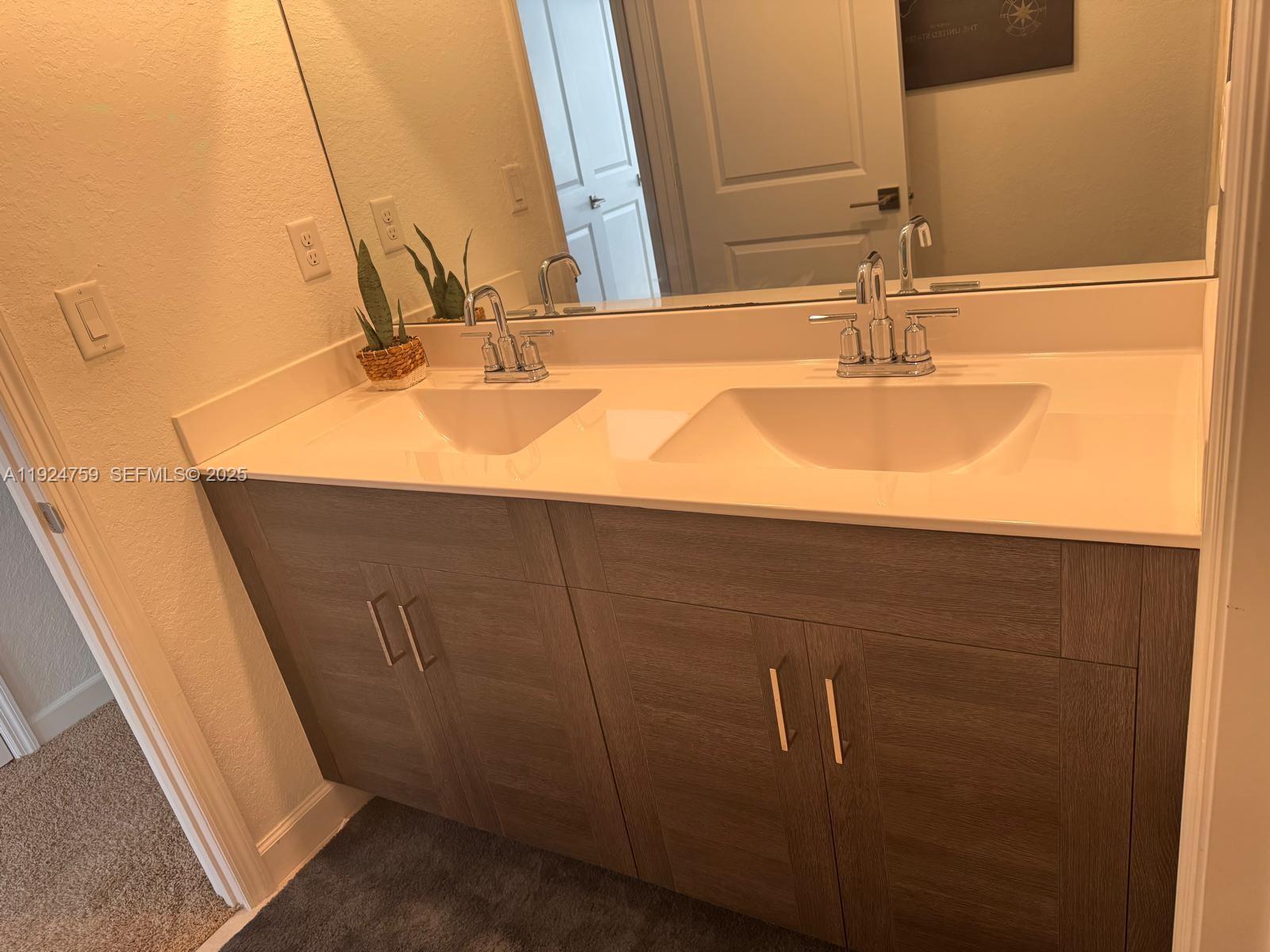 13201 Southwest 269th Terrace Homestead, FL 33032 - Photo 17 of 33 a bathroom with a sink and a mirror