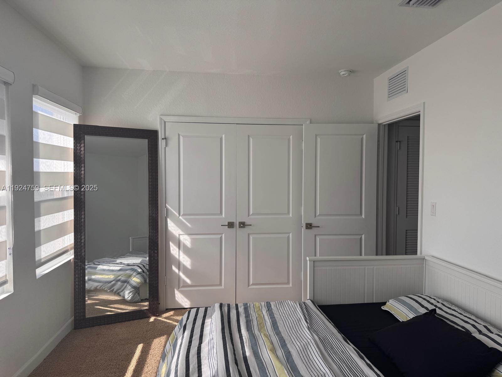 13201 Southwest 269th Terrace Homestead, FL 33032 - Photo 19 of 33 a view of a room with wooden floor and windows