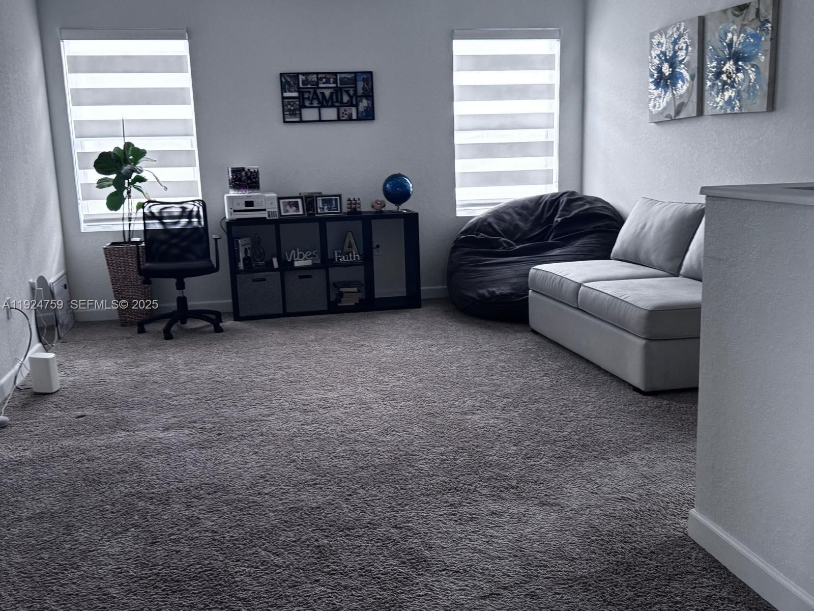 13201 Southwest 269th Terrace Homestead, FL 33032 - Photo 3 of 33 a living room with furniture and a window