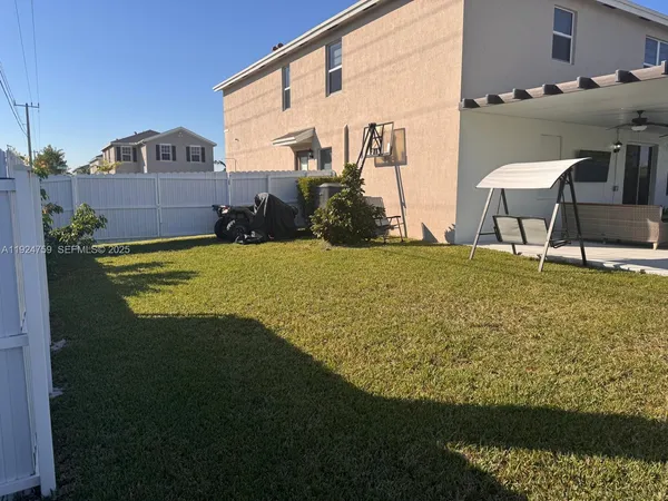a view of a back yard of the house