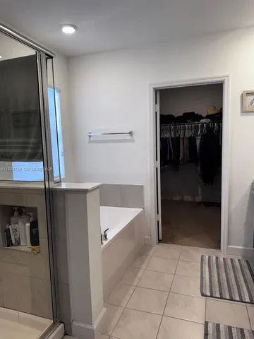 a view of hallway with washer and dryer