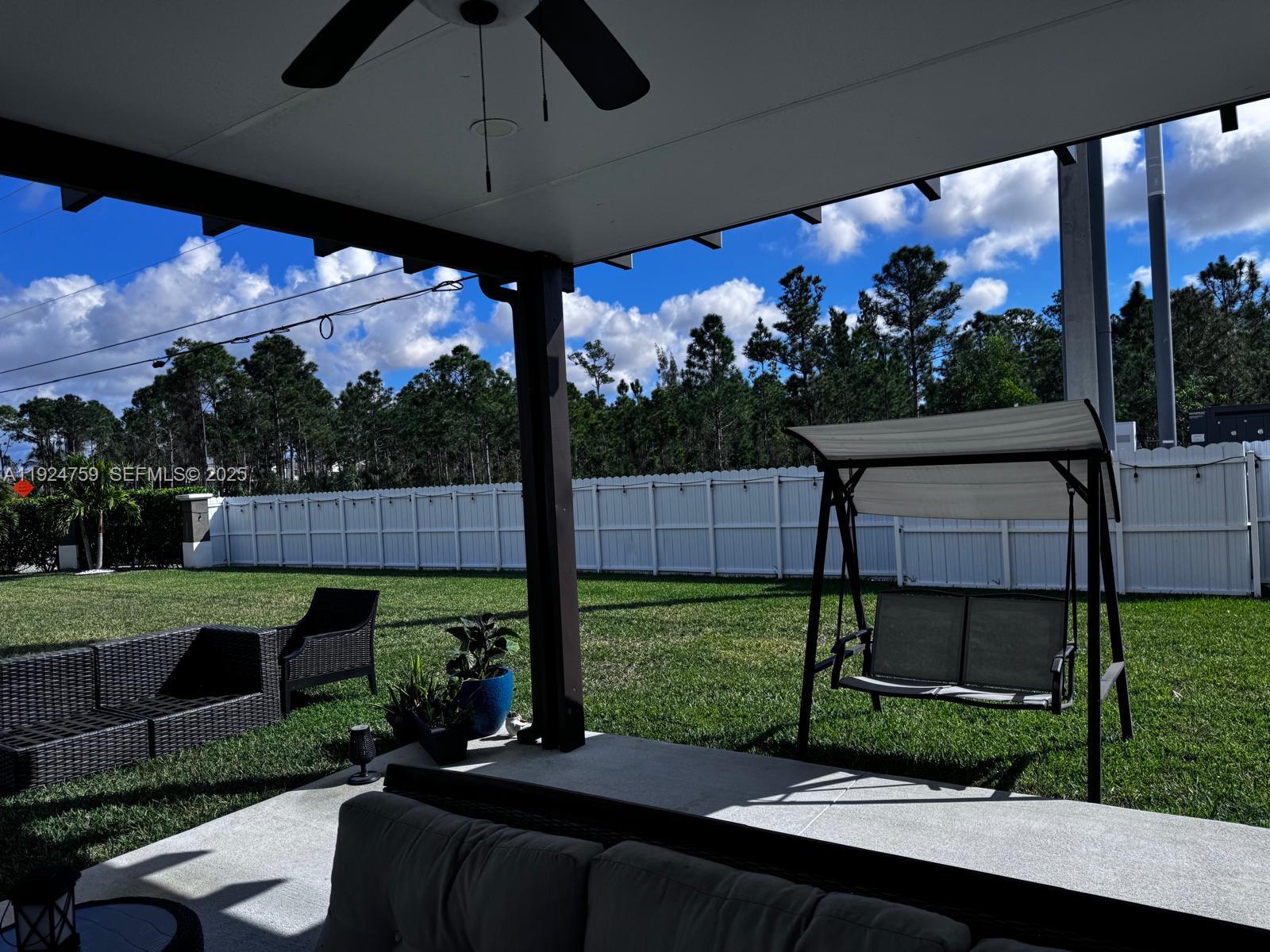 13201 Southwest 269th Terrace Homestead, FL 33032 - Photo 8 of 33 a view of a porch with furniture and garden