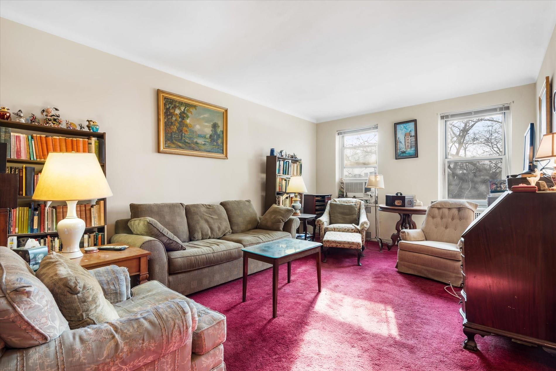 34-41 85th Street, Unit 4S Queens, NY 11372 - Photo 6 of 20 Living room featuring carpet floors
