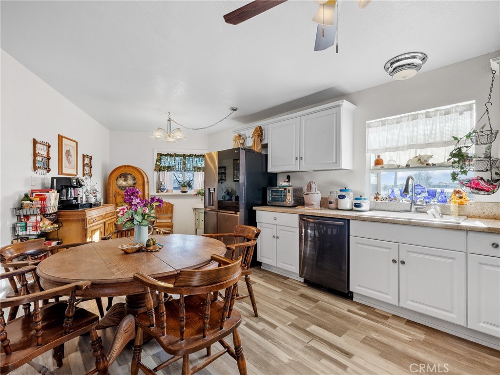 22977 El Centro Road Apple Valley, CA 92307 - Photo 14 of 30 a view of a dining room kitchen and a window