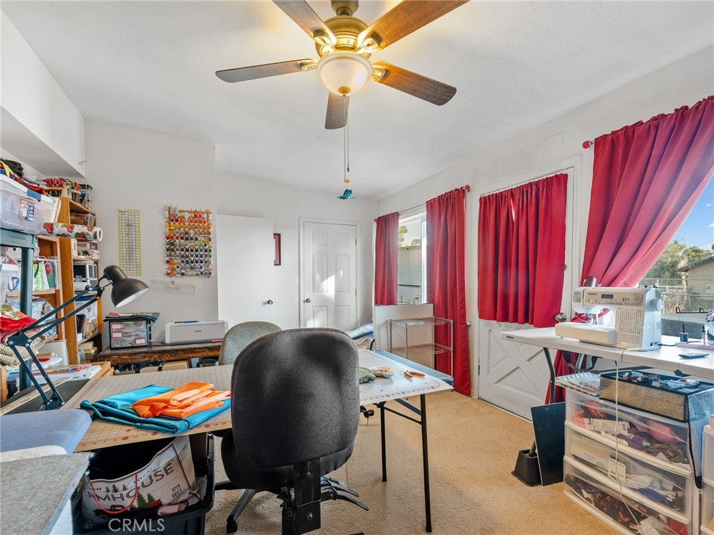 22977 El Centro Road Apple Valley, CA 92307 - Photo 19 of 30 a room with furniture and a window