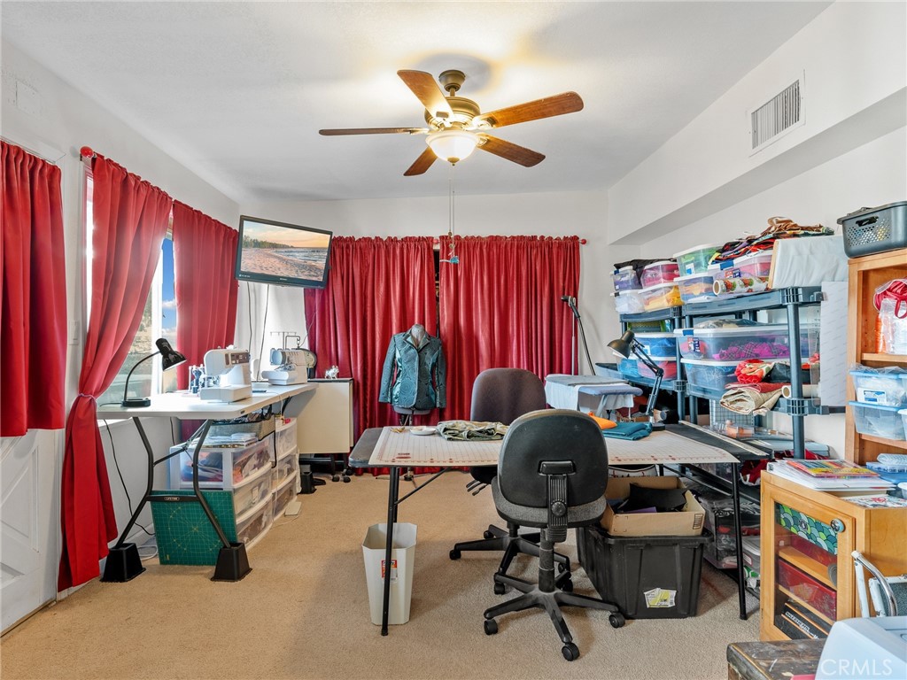 22977 El Centro Road Apple Valley, CA 92307 - Photo 20 of 30 a view of a workspace with furniture and a window